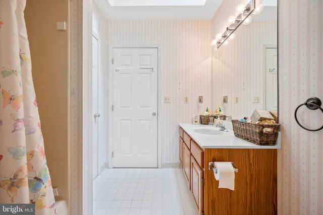 a house view with swimming pool and trees in front of it