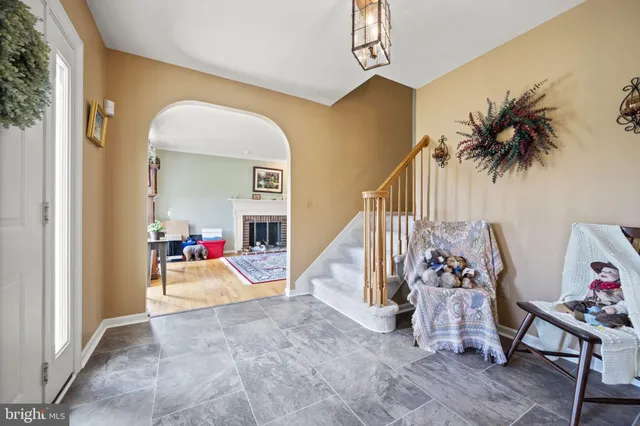 a view of a livingroom with wooden floor and a livingroom