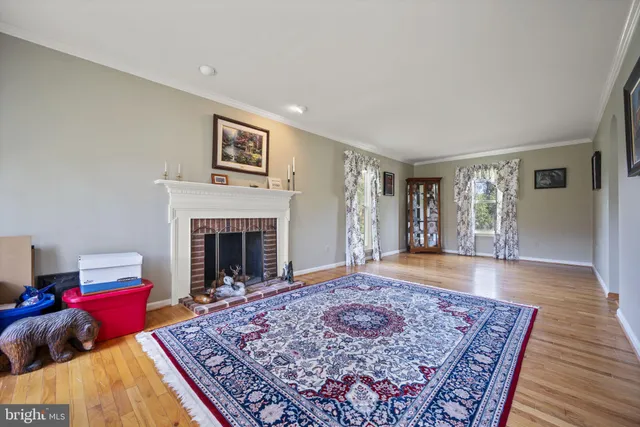 a living room with a couch and a fireplace
