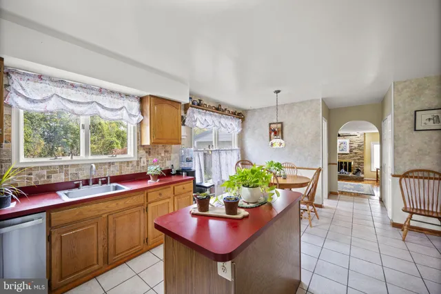 a kitchen with a table and chairs in it