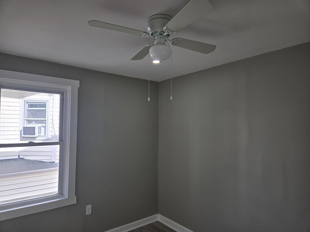 90 Quequechan Street, Unit 2 Fall River, MA 02723 - Photo 7 of 20 an empty room with a window