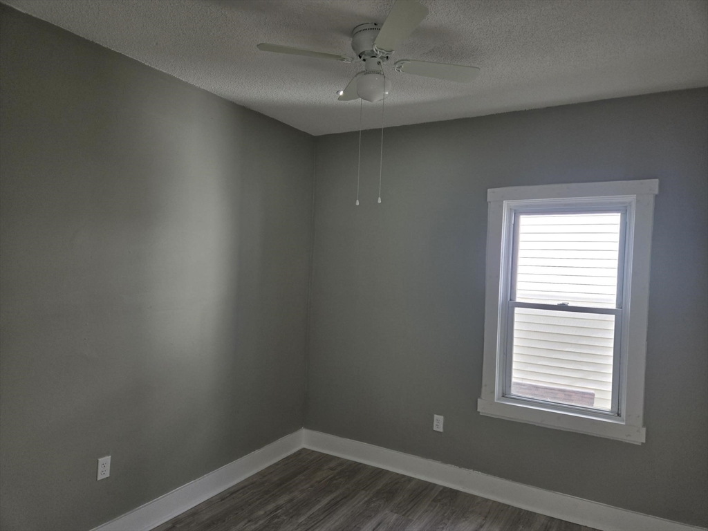 90 Quequechan Street, Unit 2 Fall River, MA 02723 - Photo 8 of 20 an empty room with a window
