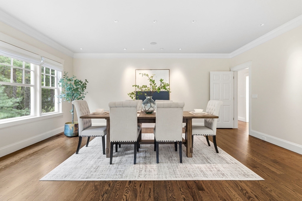 244 Musterfield Road Concord, MA 01742 - Photo 19 of 42 a dining room with furniture a rug and a window
