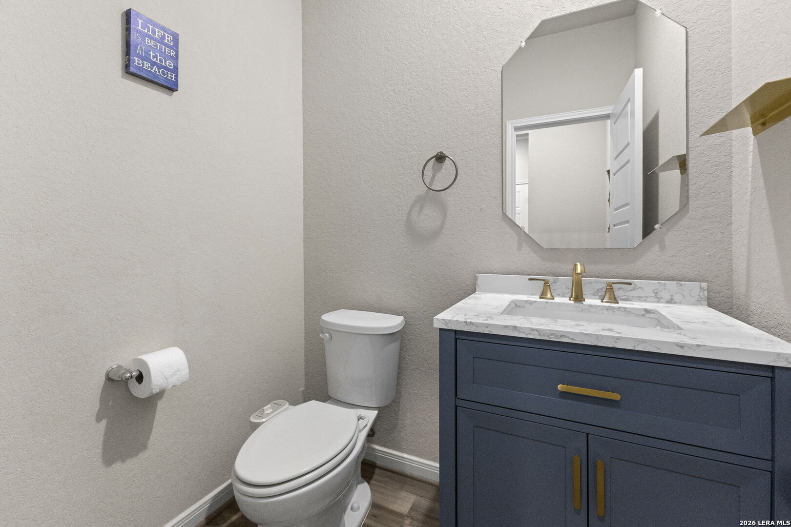 12221 Icon Ridge San Antonio, TX 78253 - Photo 31 of 46 a bathroom with a granite countertop toilet sink and mirror