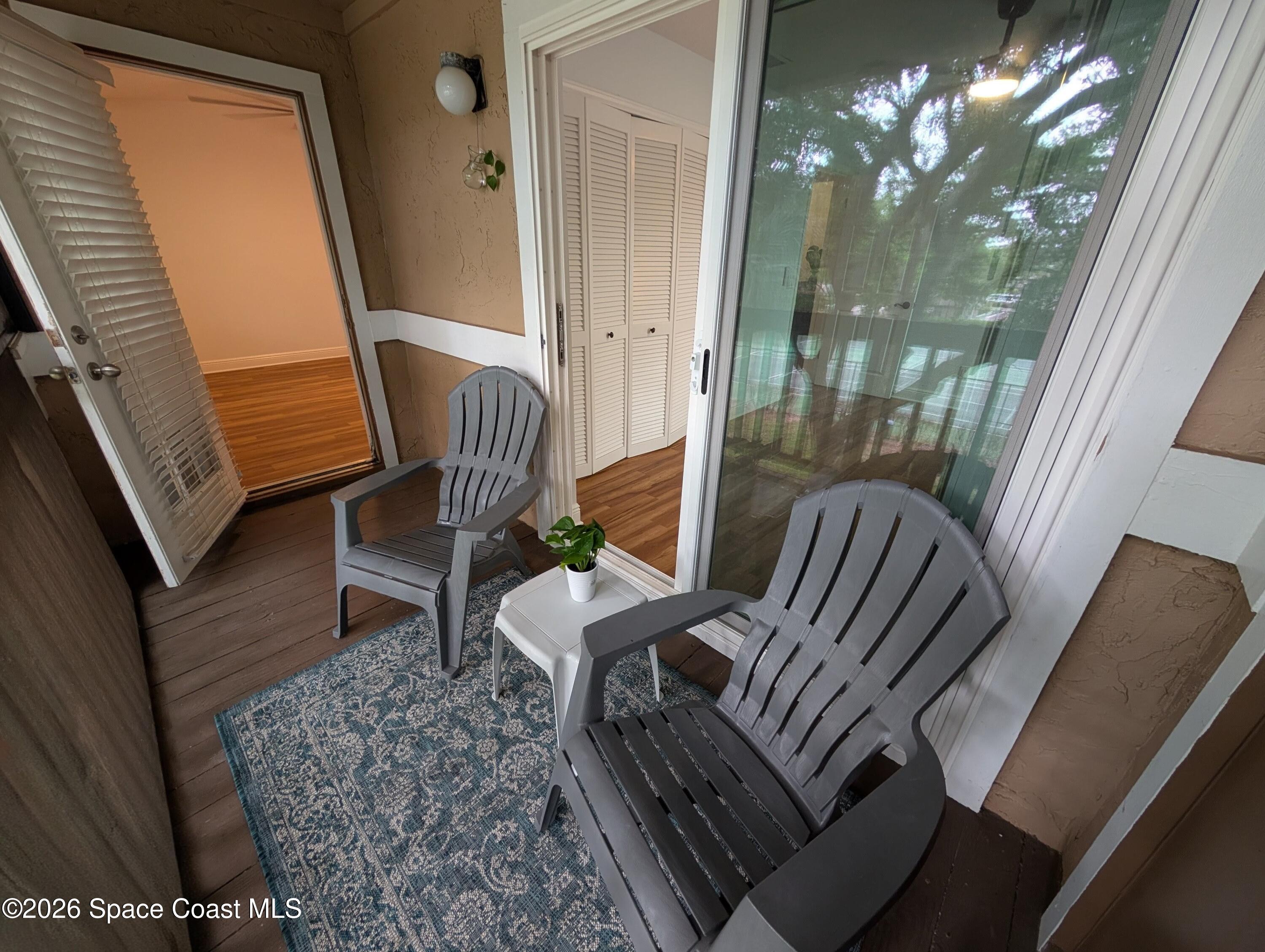 7667 North Wickham Road, Unit 818 Melbourne, FL 32940 - Photo 15 of 29 a view of balcony with furniture