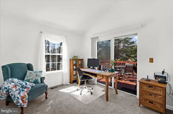 a workspace with furniture and a window