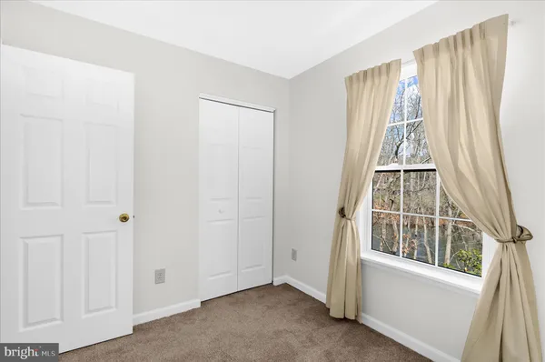 a bathroom with a sink a toilet and shower curtain