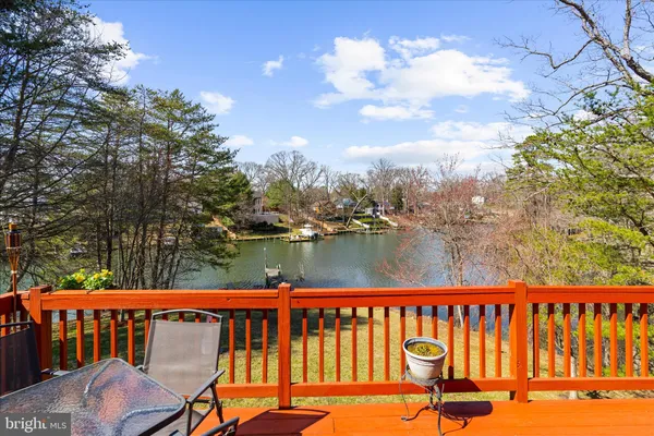 a view of a roof deck with wooden fence