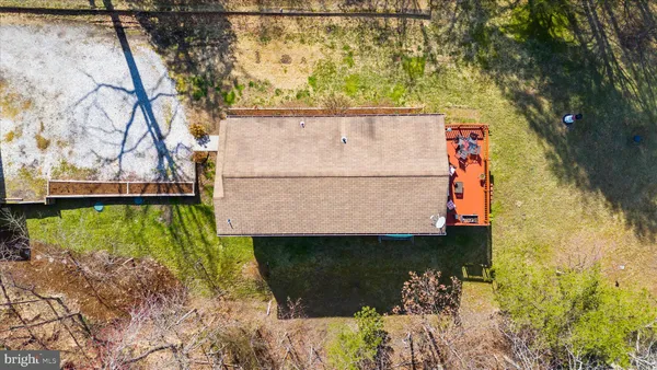 an aerial view of residential building with outdoor space and lake view