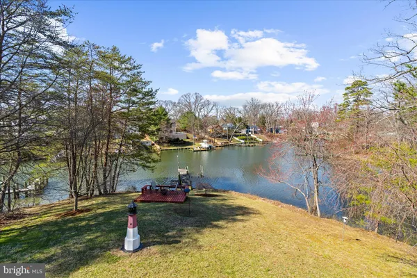 a view of a lake with a yard