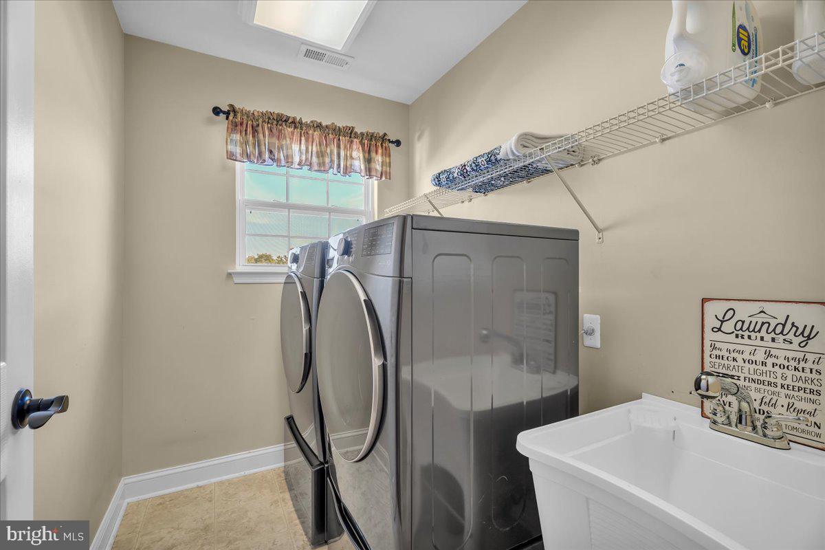 74 Candlewood Road Williamstown, NJ 08094 - Photo 20 of 45 Modern laundry room with natural light.