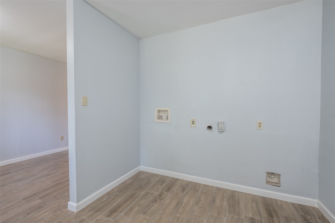 606 West Street Georgetown, TX 78626 - Photo 11 of 36 Laundry area with washer hookup and light wood finished floors