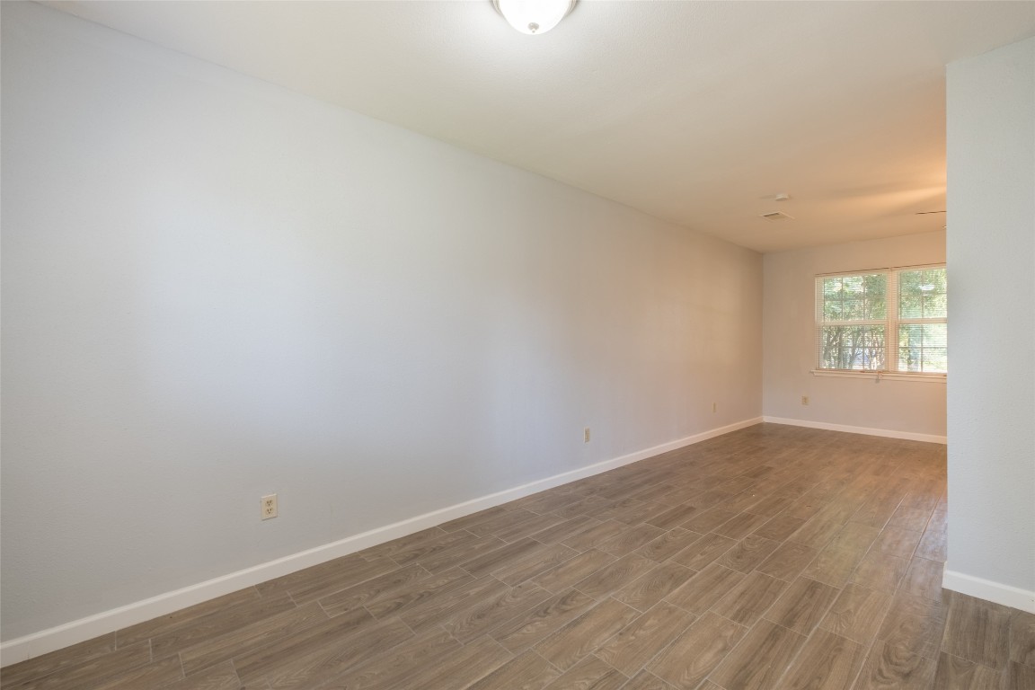 606 West Street Georgetown, TX 78626 - Photo 12 of 36 Spare room with wood finish floors and baseboards