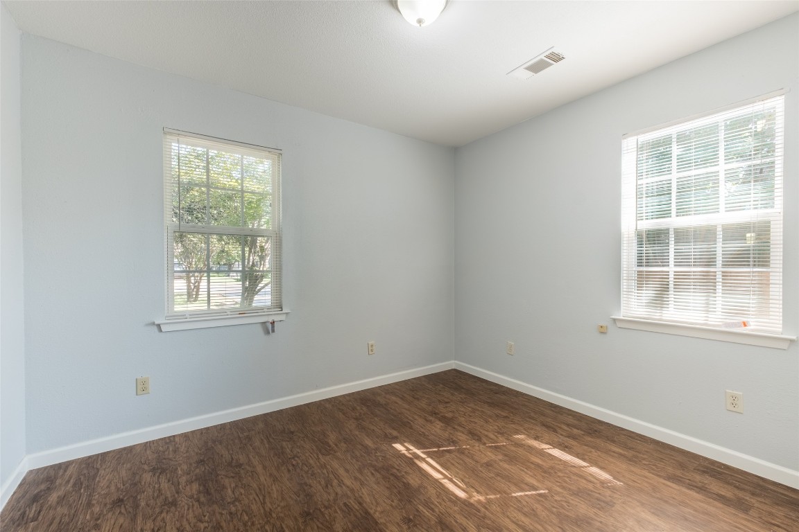 606 West Street Georgetown, TX 78626 - Photo 20 of 36 Unfurnished room with dark wood-style flooring and healthy amount of natural light