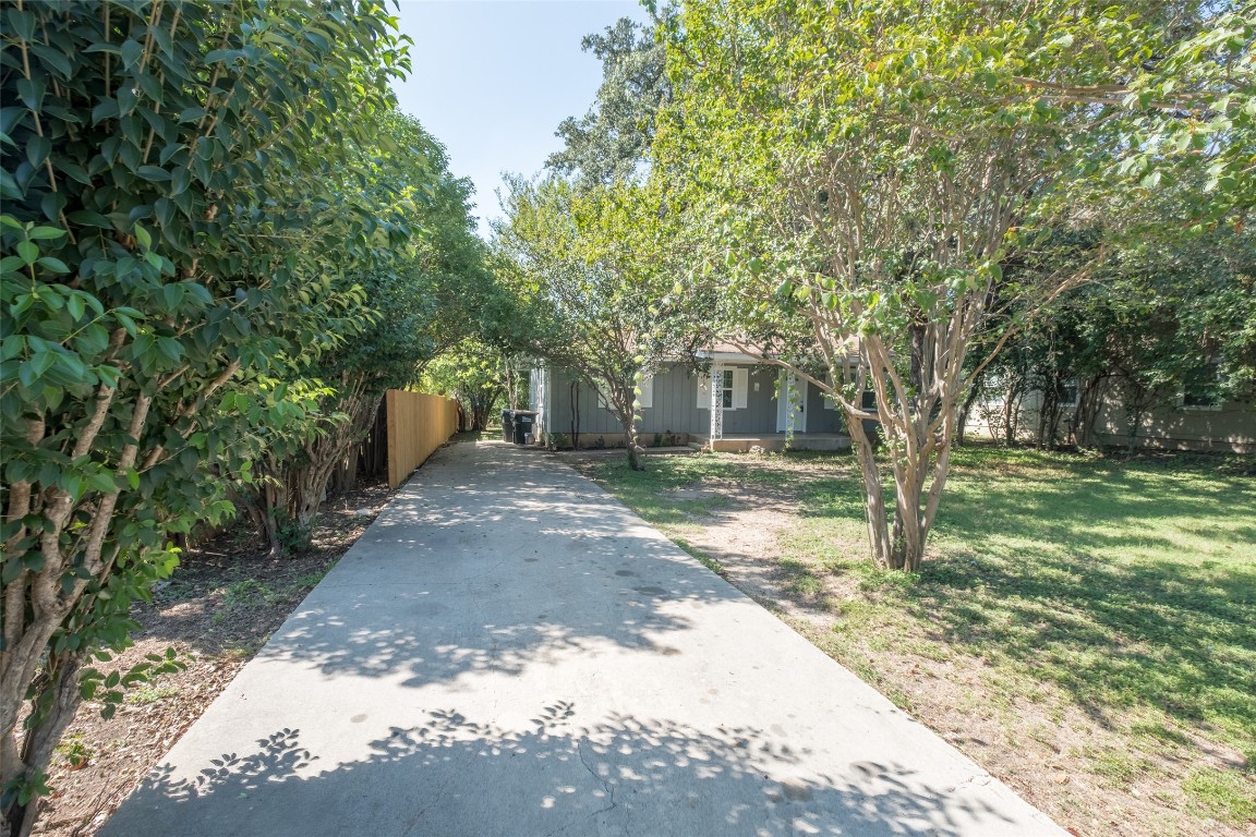 606 West Street Georgetown, TX 78626 - Photo 35 of 36 Obstructed view of property featuring a porch and concrete driveway