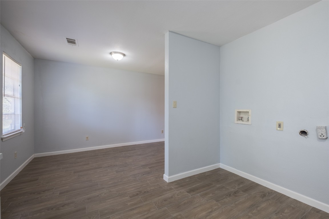 606 West Street Georgetown, TX 78626 - Photo 10 of 36 Unfurnished room with dark wood-style flooring and baseboards