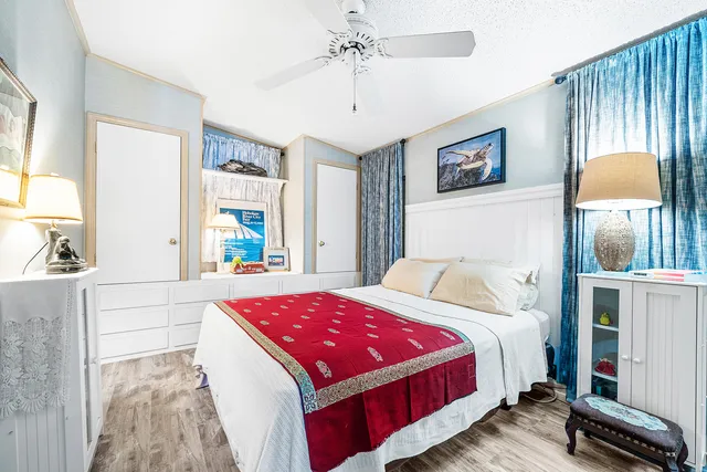 a bed room with a bed and a chandelier