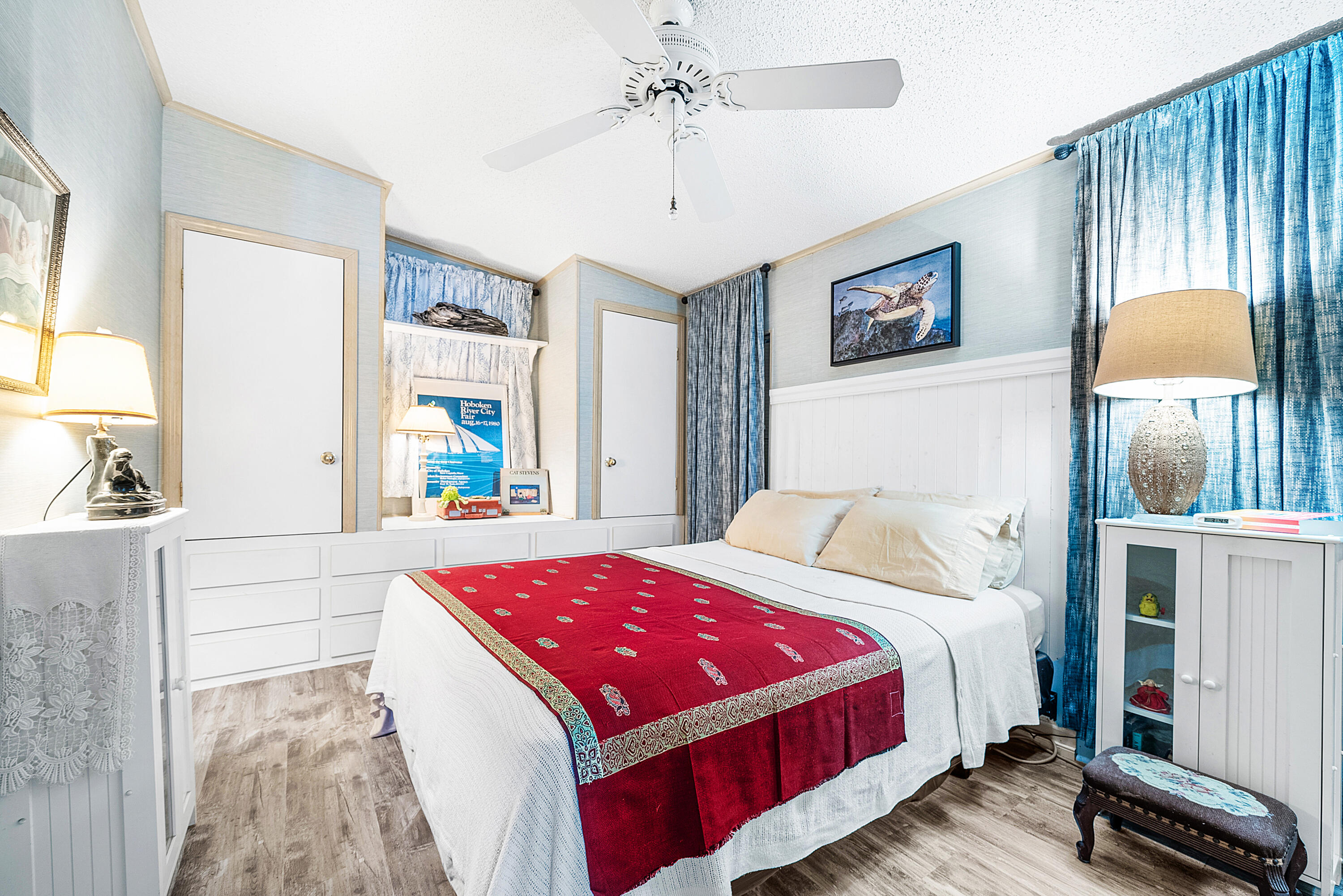 4 East Cedar Drive, Unit CD Briny Breezes, FL 33435 - Photo 16 of 28 a bed room with a bed and a chandelier