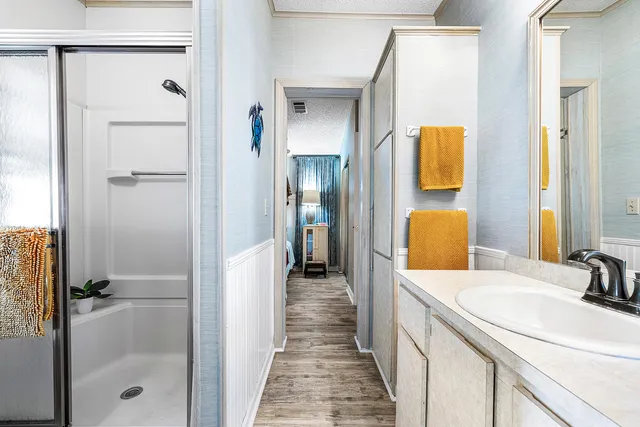 a bathroom with a sink and mirror
