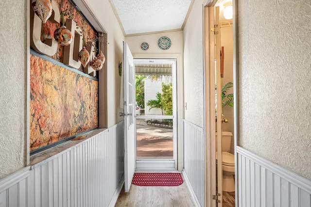 a view of a front door of the house and city view