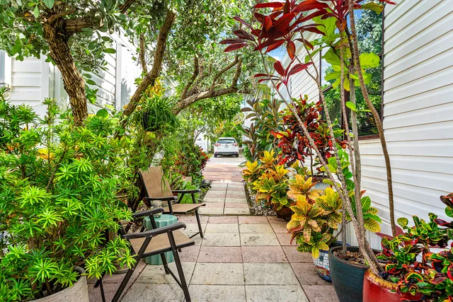 a view of backyard with sitting area