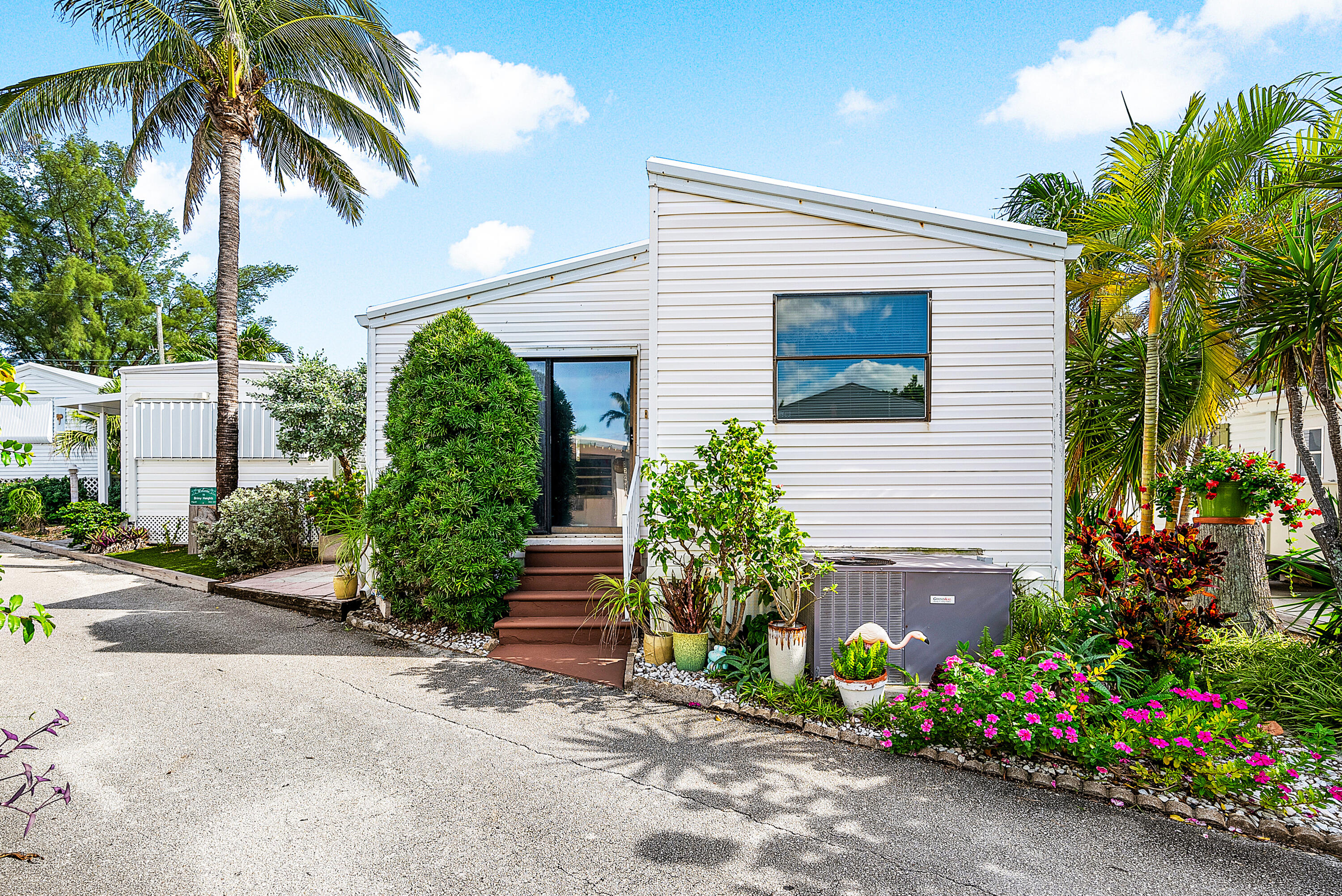4 East Cedar Drive, Unit CD Briny Breezes, FL 33435 - Photo 26 of 28 a view of a house with a backyard