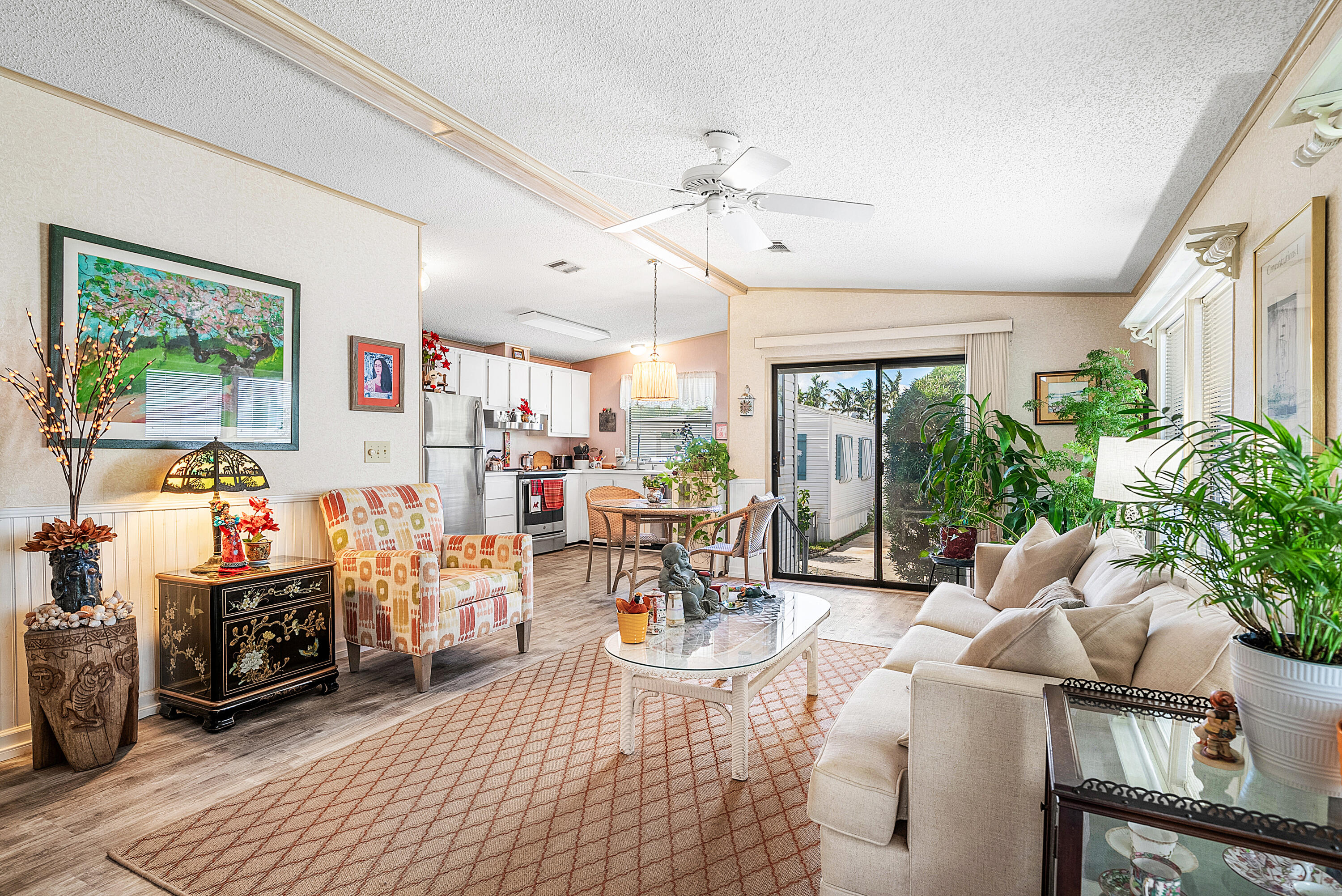 4 East Cedar Drive, Unit CD Briny Breezes, FL 33435 - Photo 3 of 28 a living room with furniture and a large window