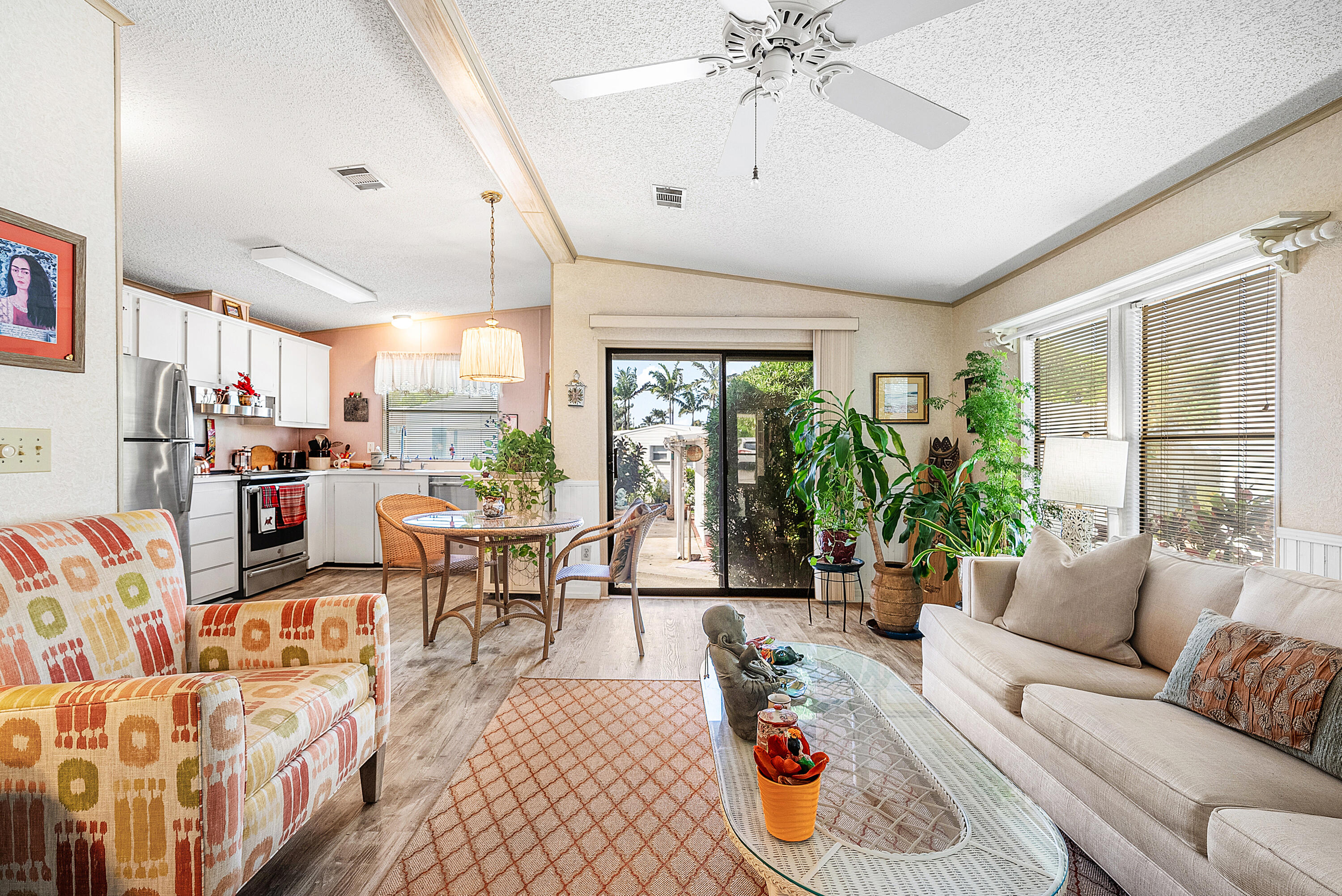 4 East Cedar Drive, Unit CD Briny Breezes, FL 33435 - Photo 6 of 28 a living room with furniture and a large window