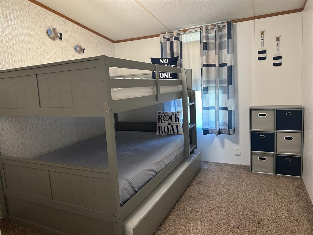 21516 Water Ridge Road Chandler, TX 75758 - Photo 17 of 40 a view of walk in closet