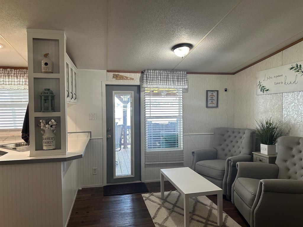 21516 Water Ridge Road Chandler, TX 75758 - Photo 18 of 40 a living room with furniture and wooden floor