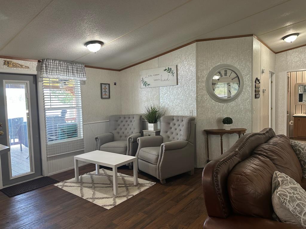21516 Water Ridge Road Chandler, TX 75758 - Photo 19 of 40 a living room with furniture a window and wooden floor
