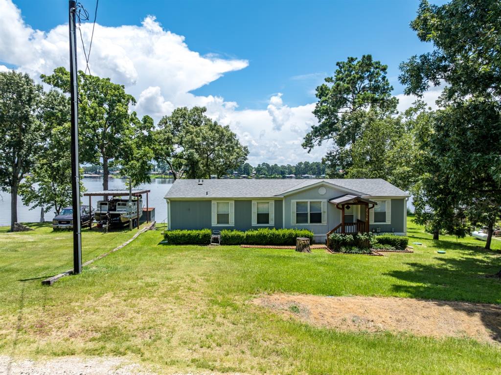 21516 Water Ridge Road Chandler, TX 75758 - Photo 2 of 40 a front view of a house with a yard