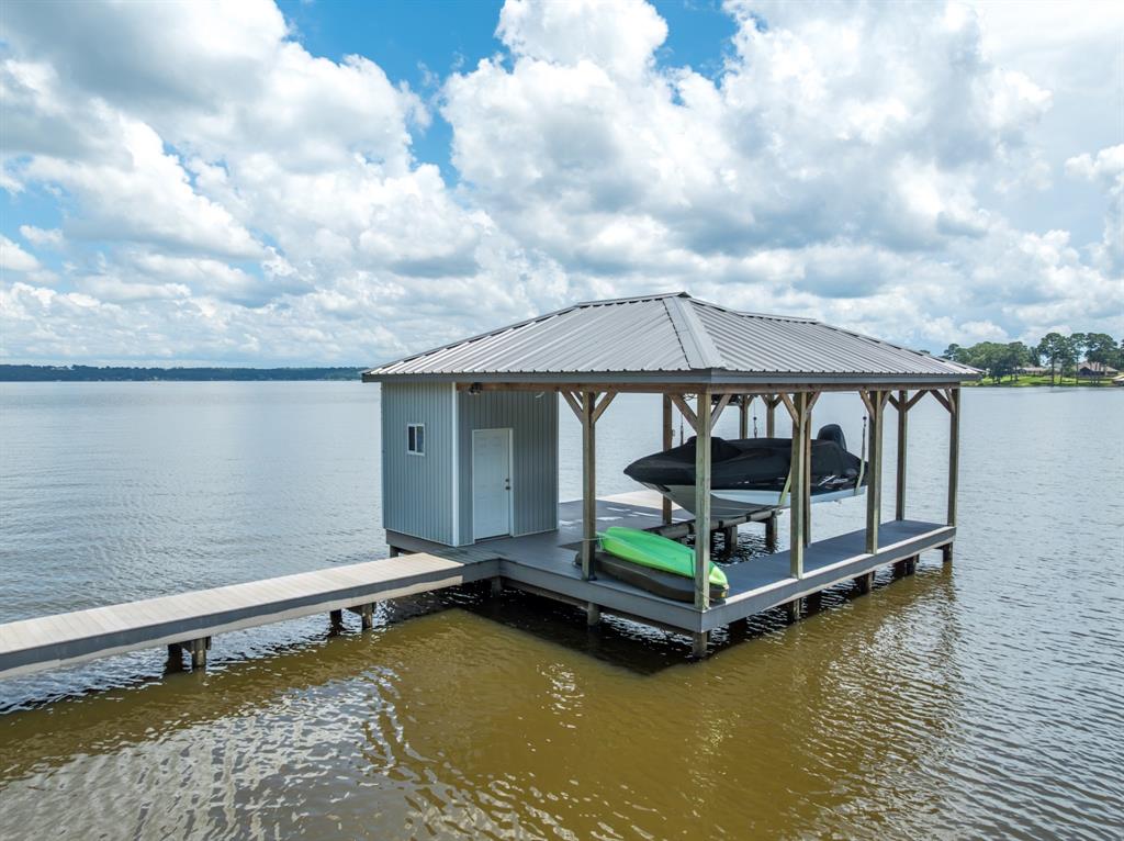 21516 Water Ridge Road Chandler, TX 75758 - Photo 29 of 40 a small pool with lawn chairs