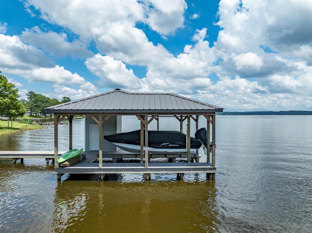 21516 Water Ridge Road Chandler, TX 75758 - Photo 30 of 40 a view of house with swimming pool and lake view