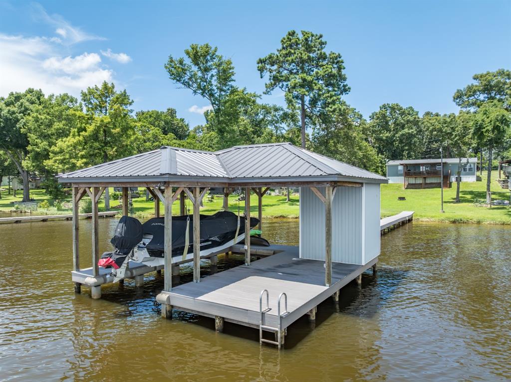 21516 Water Ridge Road Chandler, TX 75758 - Photo 34 of 40 a small pool with table and chairs