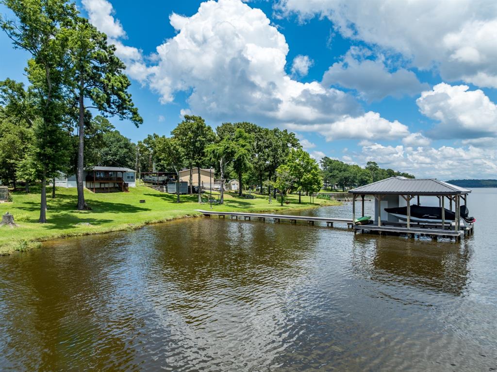 21516 Water Ridge Road Chandler, TX 75758 - Photo 35 of 40 a view of a lake with houses in the back