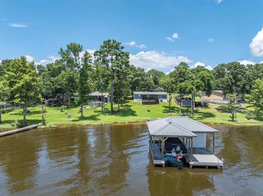 21516 Water Ridge Road Chandler, TX 75758 - Photo 36 of 40 a view of a lake with a house swimming pool and outdoor space