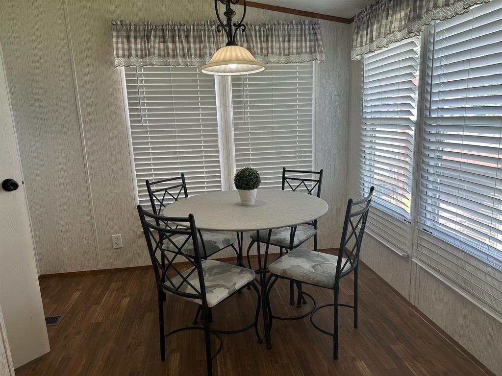 21516 Water Ridge Road Chandler, TX 75758 - Photo 9 of 40 a view of a dining room with furniture and wooden floor