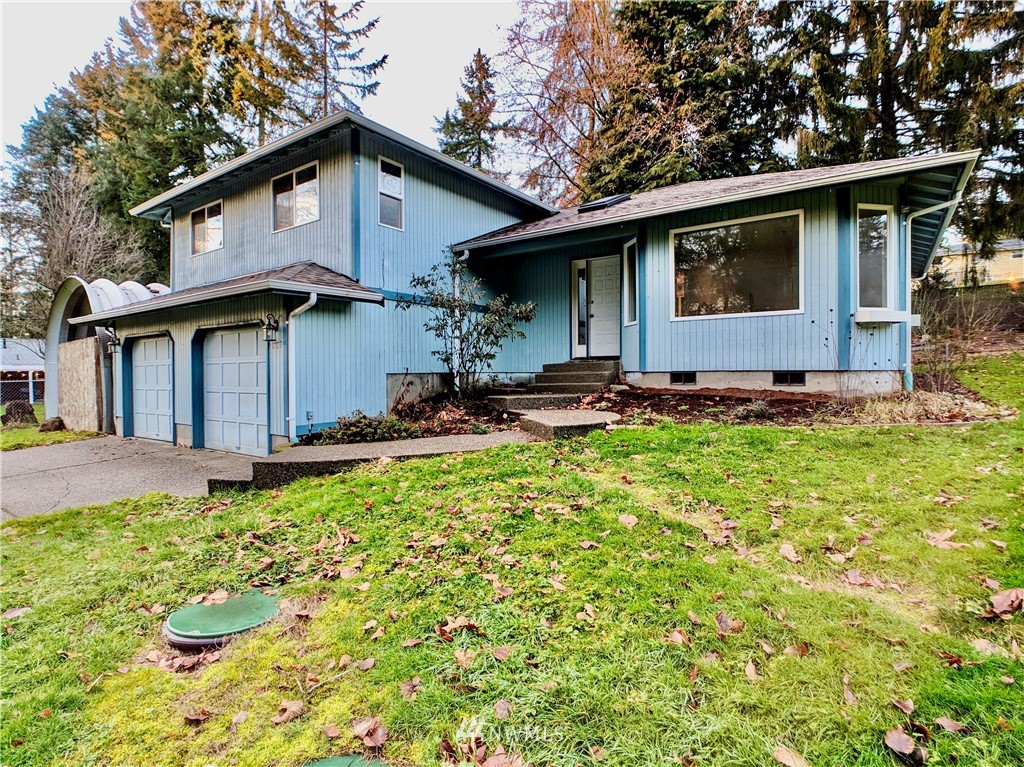 17819 Southeast 137th Street Renton, WA 98059 - Photo 1 of 37 a front view of a house with a yard