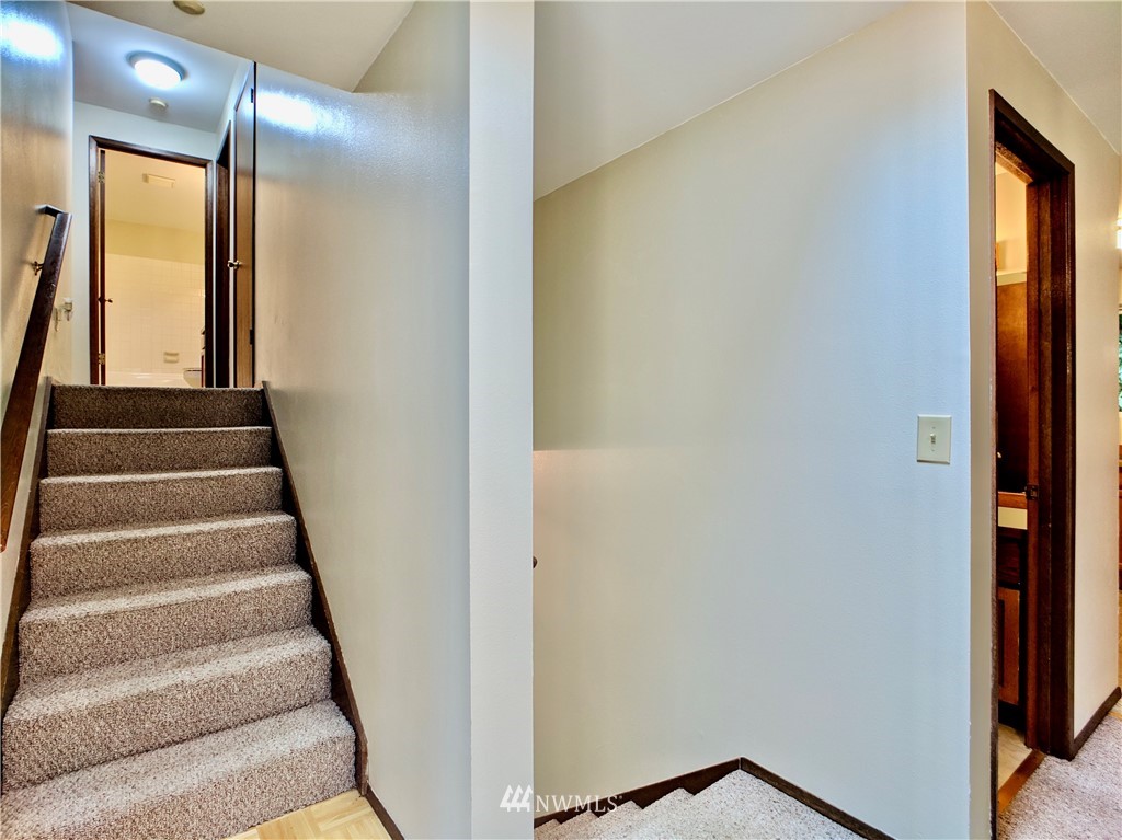 17819 Southeast 137th Street Renton, WA 98059 - Photo 15 of 37 a view of staircase with lots of frames on wall and a window
