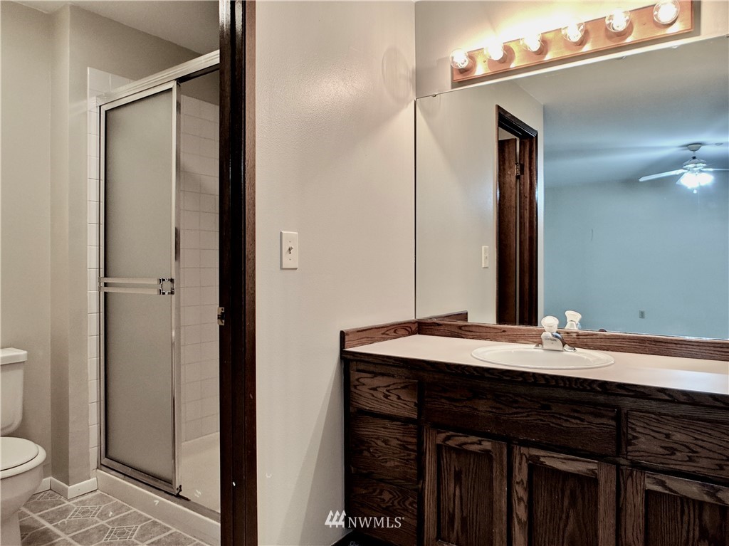 17819 Southeast 137th Street Renton, WA 98059 - Photo 19 of 37 a bathroom with a sink and a mirror