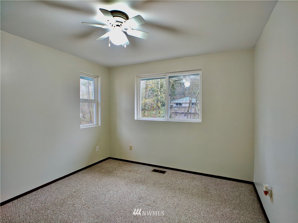 17819 Southeast 137th Street Renton, WA 98059 - Photo 23 of 37 an empty room with windows and fan