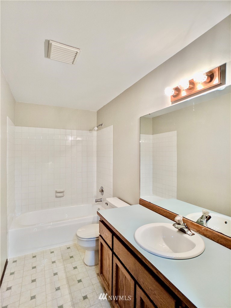 17819 Southeast 137th Street Renton, WA 98059 - Photo 25 of 37 a bathroom with a sink a toilet a shower and a mirror