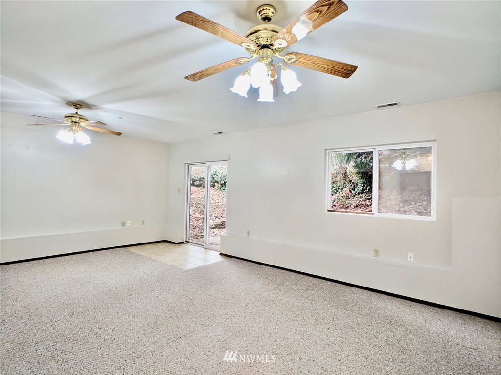 17819 Southeast 137th Street Renton, WA 98059 - Photo 27 of 37 an empty room with windows and fan