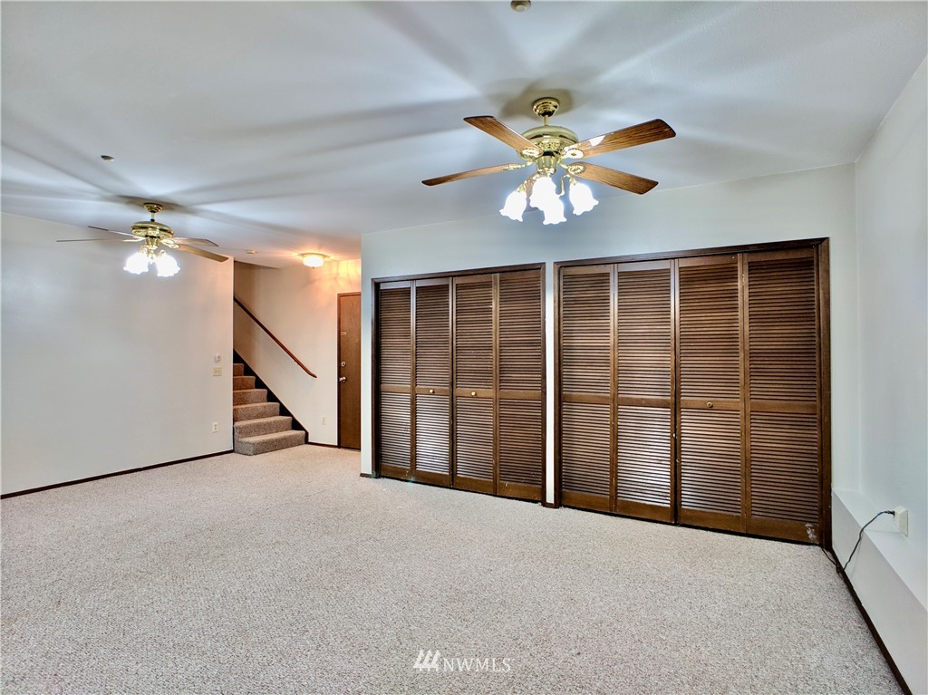 17819 Southeast 137th Street Renton, WA 98059 - Photo 30 of 37 a view of a livingroom with a ceiling fan and window