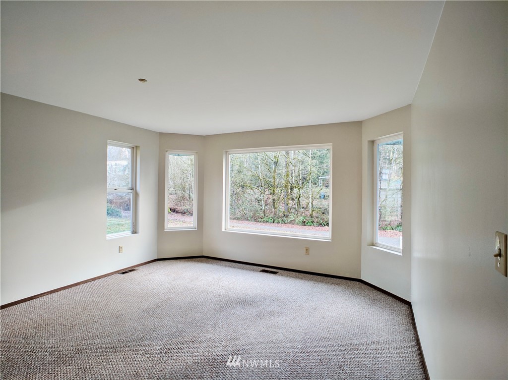 17819 Southeast 137th Street Renton, WA 98059 - Photo 5 of 37 an empty room with windows