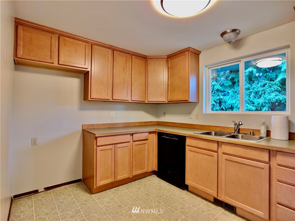 17819 Southeast 137th Street Renton, WA 98059 - Photo 10 of 37 a kitchen with a sink cabinets and window