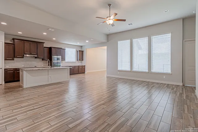 a view of kitchen with wooden floor and window