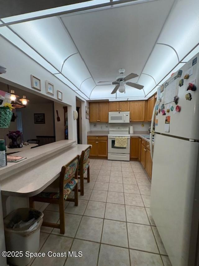 995 Botany Lane Rockledge, FL 32955 - Photo 16 of 44 a kitchen with refrigerator and chairs