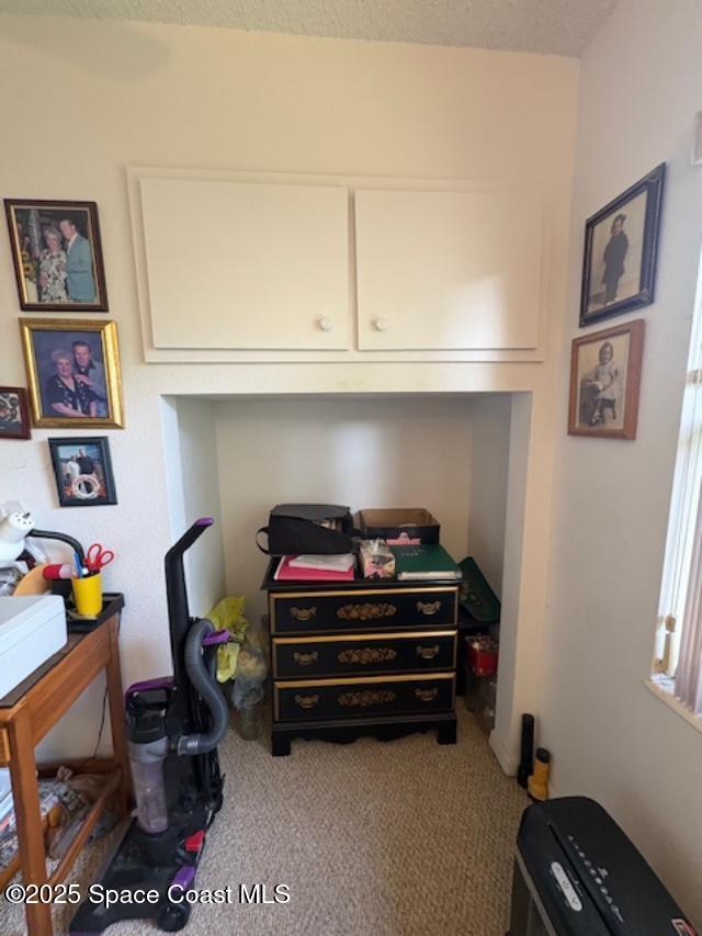 995 Botany Lane Rockledge, FL 32955 - Photo 25 of 64 a room with furniture and a bookshelf